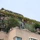 Illustration for article titled Chinese doctor builds illegal rock villa atop Beijing apartment tower